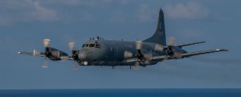 A CP-140M Aurora passes HMCS Regina during an ARTEMIS mission (photo: MCpl PJ Letourneau, CFCC)