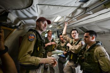 Plane side briefing onboard a VP-40 P-3C during the final P-3 deployment (photo: USN)